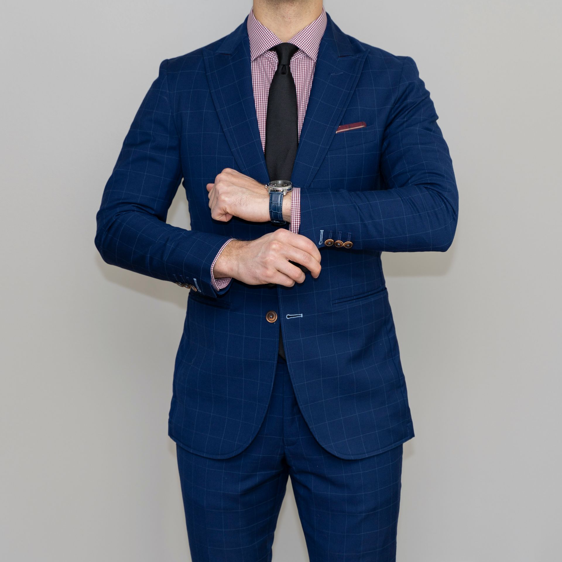 man in blue suit standing